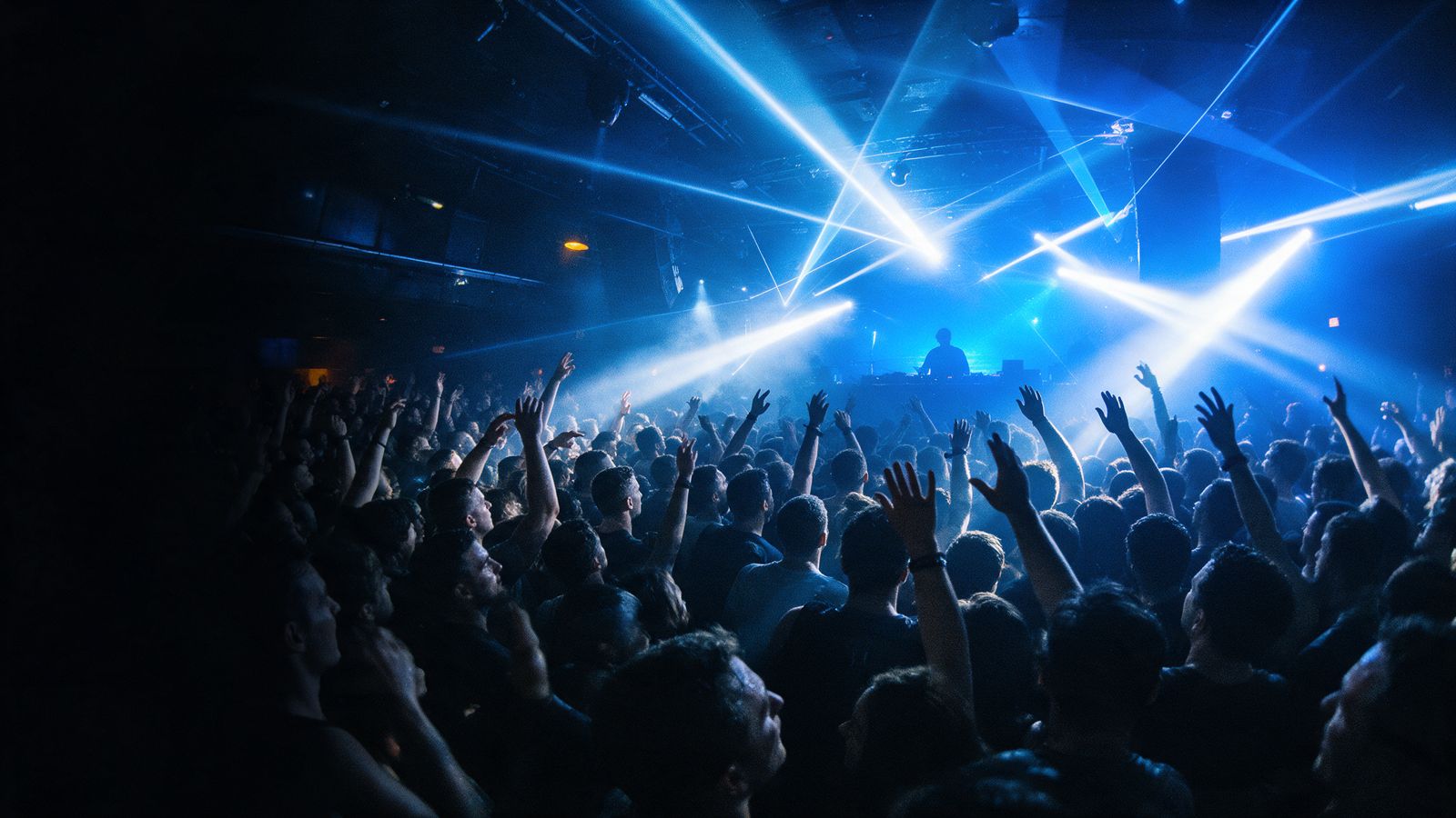 A packed dark club at peak time, hands in the air under lasers and strobes